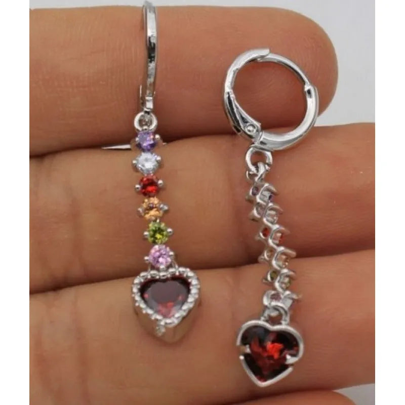 A pair of women's heart-shaped alloy earrings with a gold or silver electroplated finish.