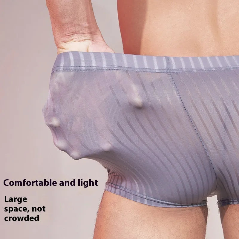 Men's striped underwear in thin transparent nylon fabric showing black, white and dark grey colour options