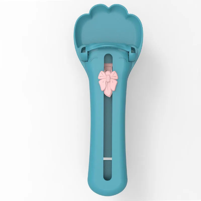 Green and pink pet feeding spoon with extrusion design for liquid food and snack dispensing