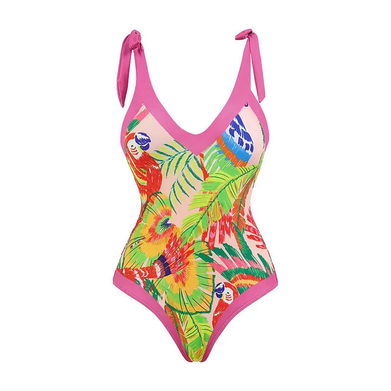 Pink floral print women's V-neck one-piece swimsuit with a thin skirt.
