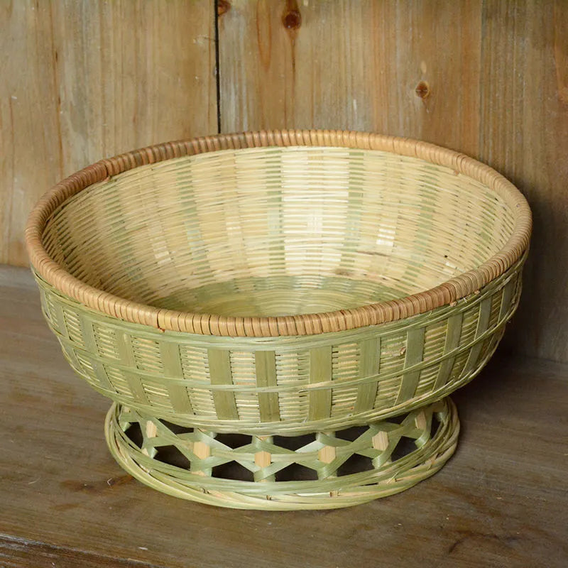Handmade woven natural bamboo storage basket shown in one of three size options.