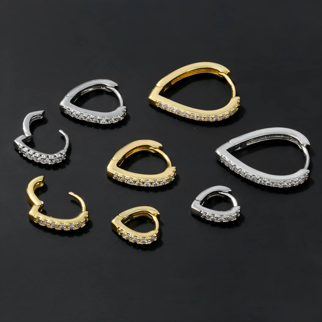 Geometric heart-shaped copper clip-on earring with gold electroplated finish.