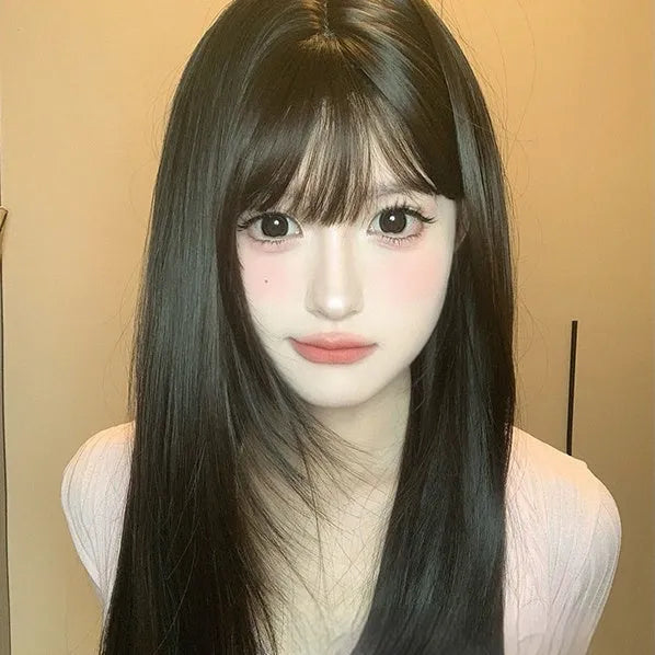 Dark brown long straight synthetic wig with fringe for round face shapes on wig head
