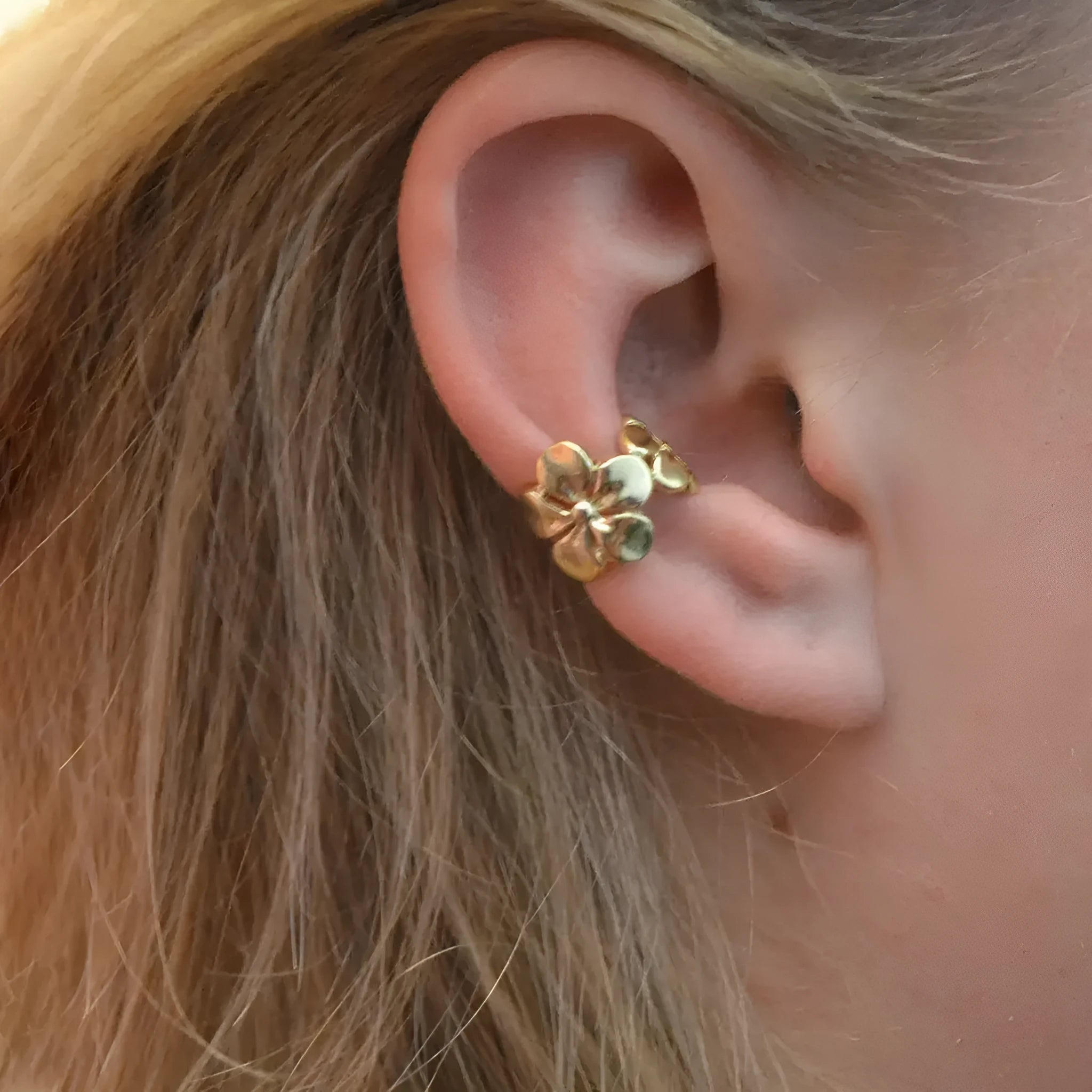 Gold women's earrings with starfish and scallop beach designs on alloy construction