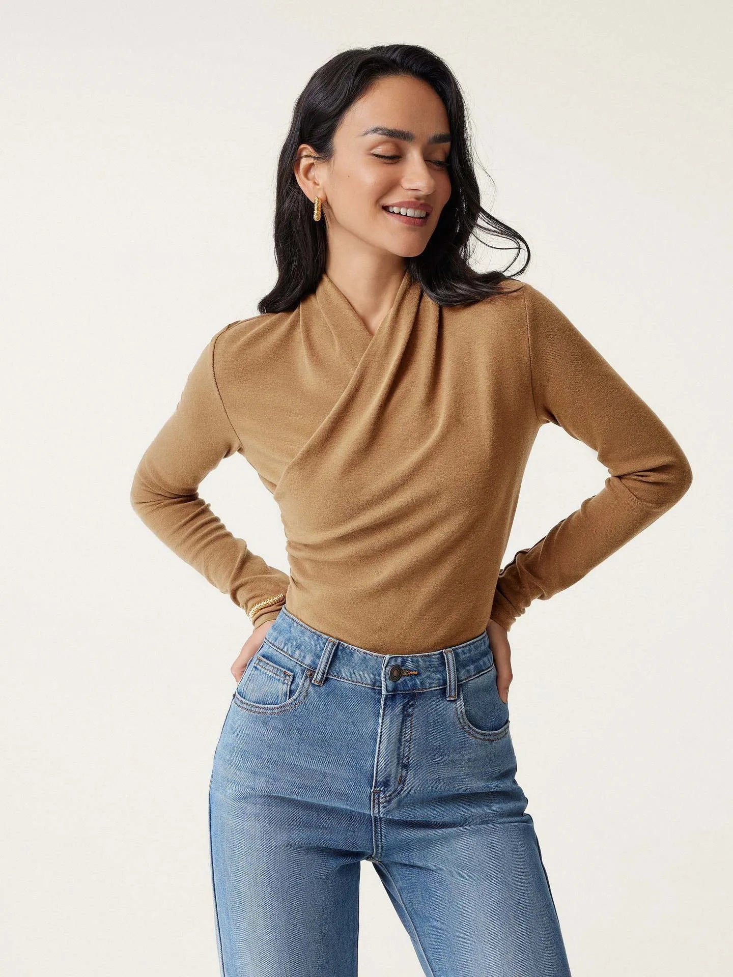 Camel coloured slim fit women's pullover sweater with long sleeves on hanger