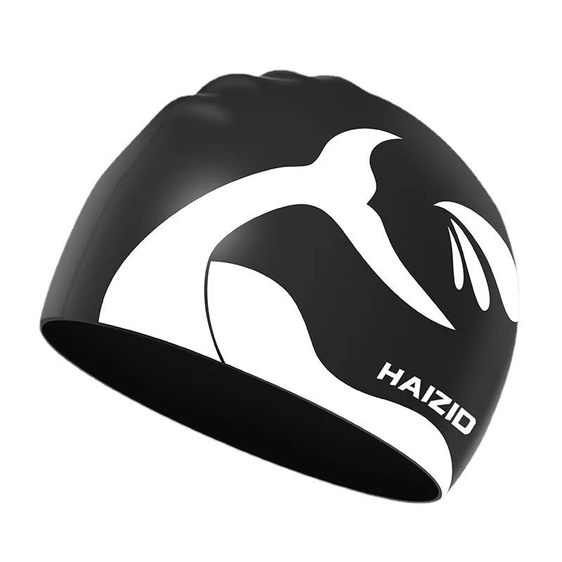 Silicone swimming cap with waterproof ear protectors featuring whale tail pattern in multiple colour options