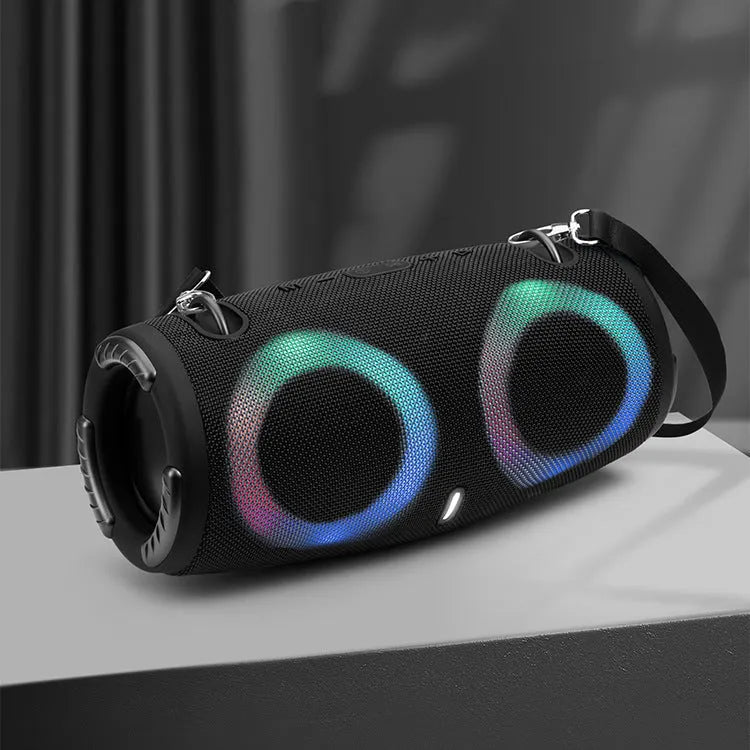 War Drum portable Bluetooth speaker with glowing RGB coloured lights in a camouflage colour variant.