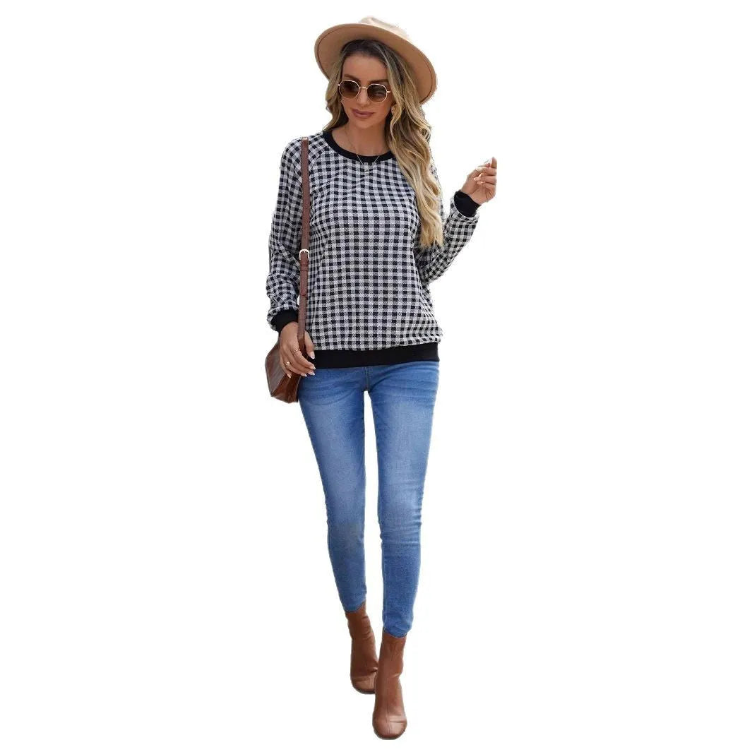Black plaid pullover sweater with long sleeves and Japanese-inspired printed pattern