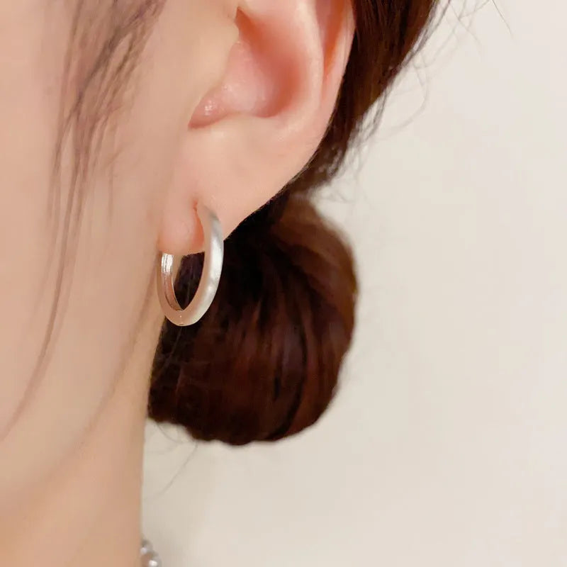 Geometric circular gold plated ear clip for women with eyelet clip mechanism