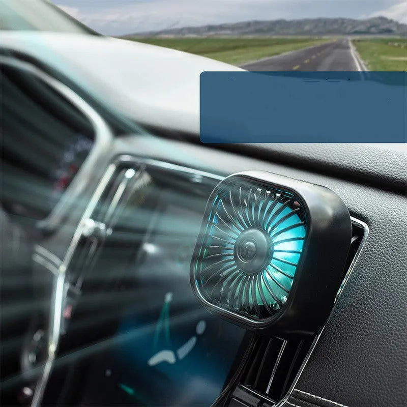 Compact black USB car fan with three speed buttons on dashboard