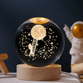 Luminous crystal ball with starry sky effect on wooden base, USB cable connected