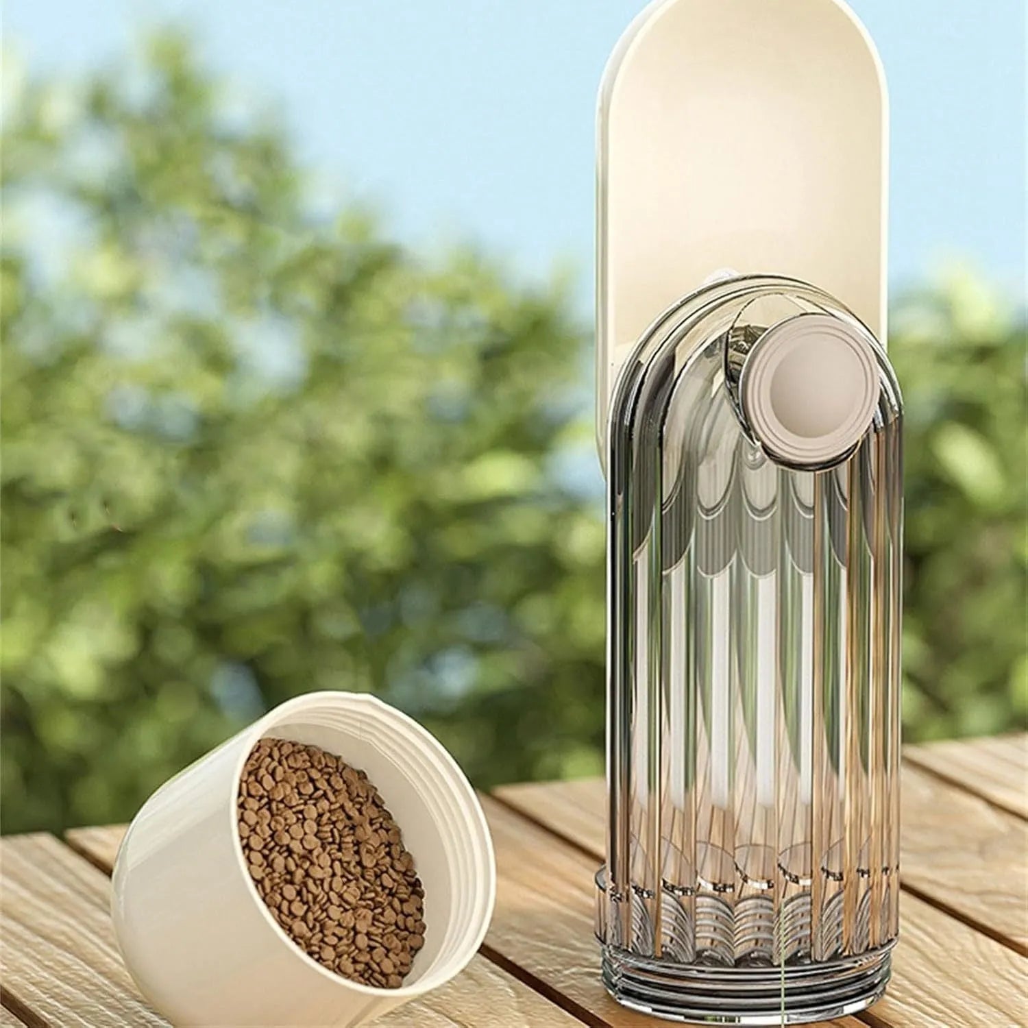 Folding dog water bottle with food dispenser in beige or green for outdoor pet activities