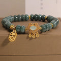 Natural emerald jade abacus bead bracelet for women with a metal safety lock closure.