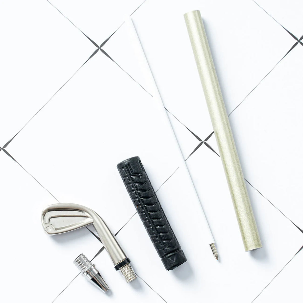 Three metal ballpoint pens with golf suit pattern design showing 0.7mm bullet-type pen heads