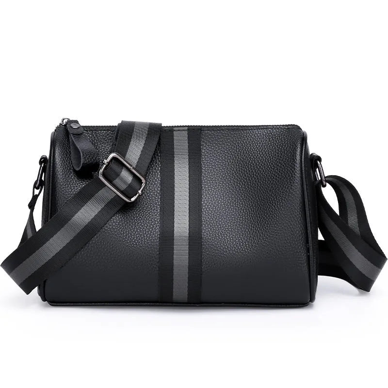Black genuine leather one-shoulder crossbody bag showing front view and adjustable strap.