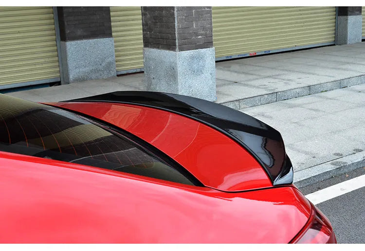 Mazda 3 Axela Exela modified tail trim with large wind surrounded blade in bright black