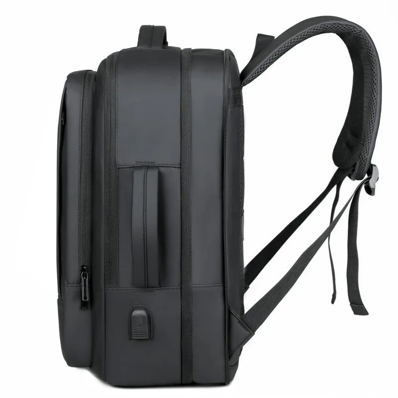 Black waterproof Oxford cloth backpack with curved shoulder strap showing 20-35 litre capacity