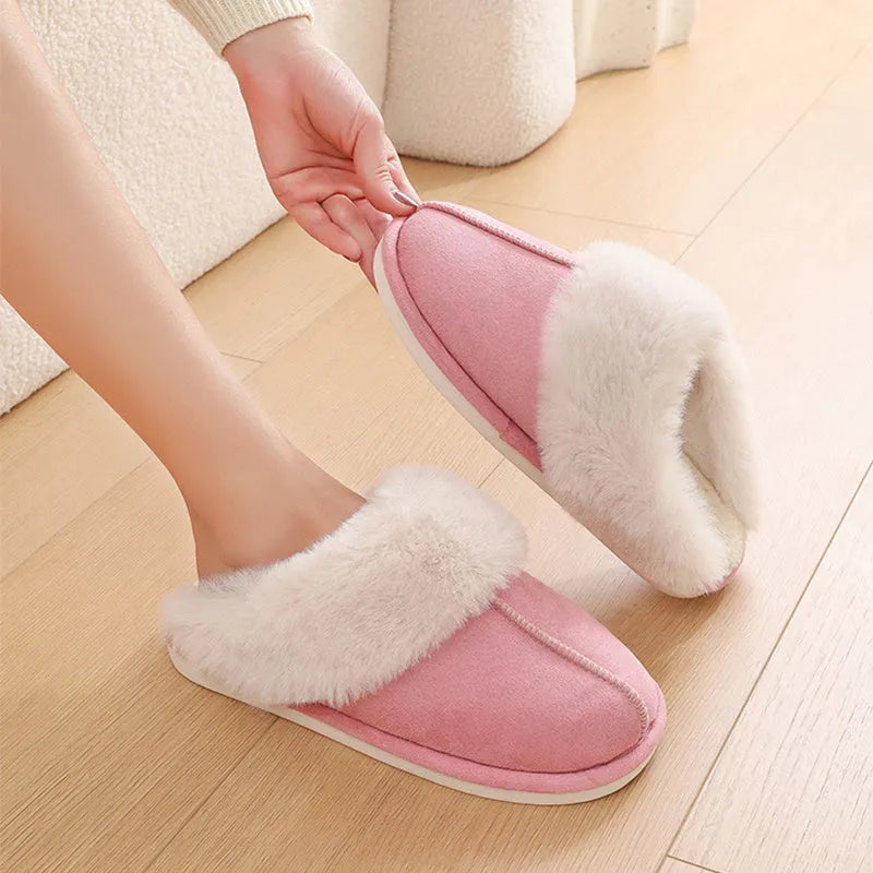 Women's plush-lined indoor slippers with round toe and flat heel in a choice of colours.