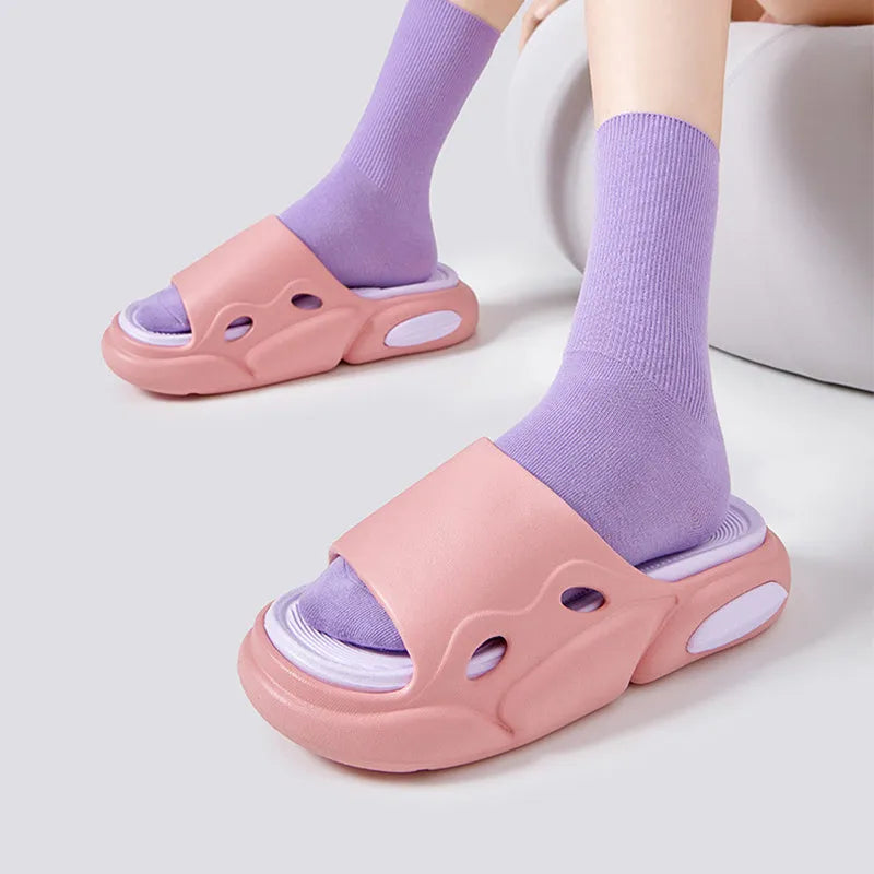 Women's and men's two-colour thick-soled EVA slippers with leather lining in pink purple, white green, or black white colour options.