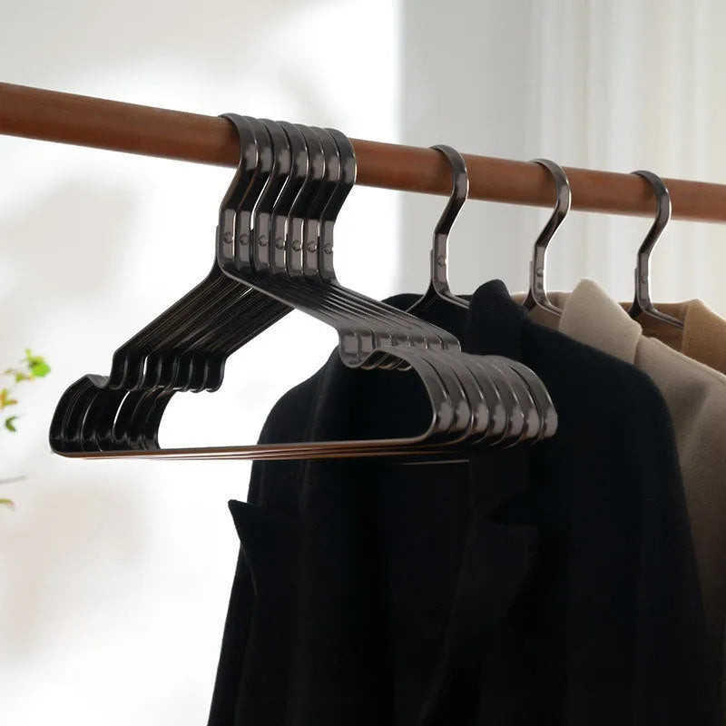 Black plastic clothes hangers with non-slip anti-rust coating for wardrobe organisation