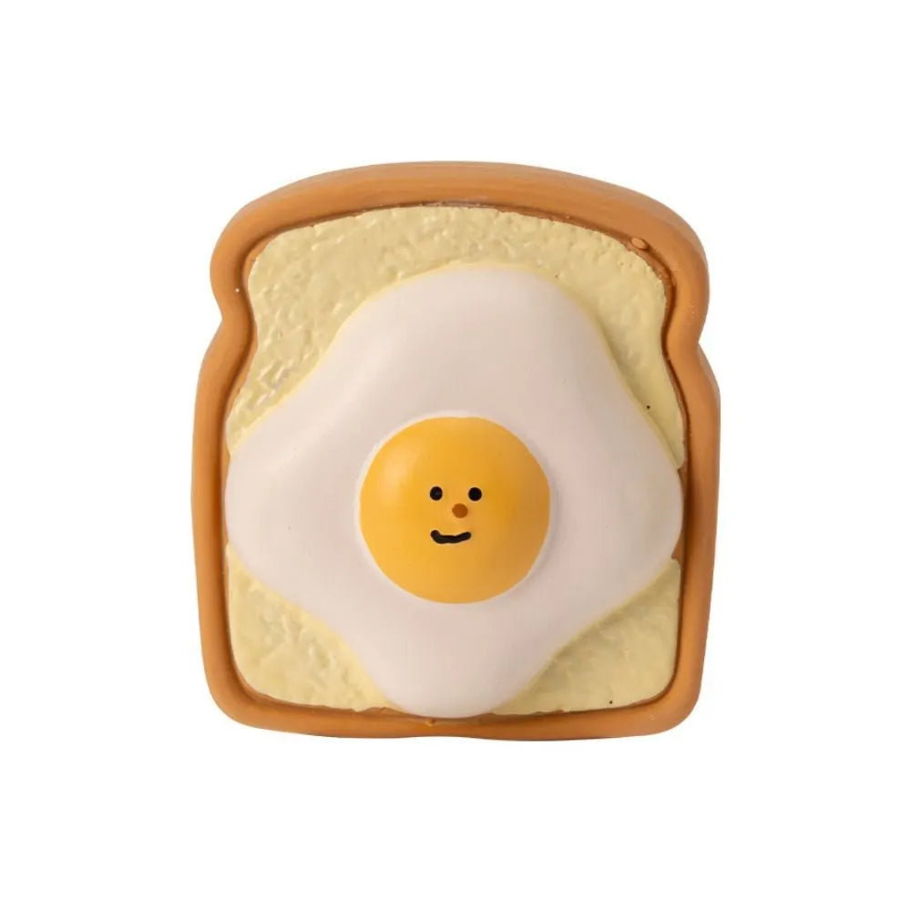 Cartoon patterned latex dog chew toy in egg bread shape with squeaker