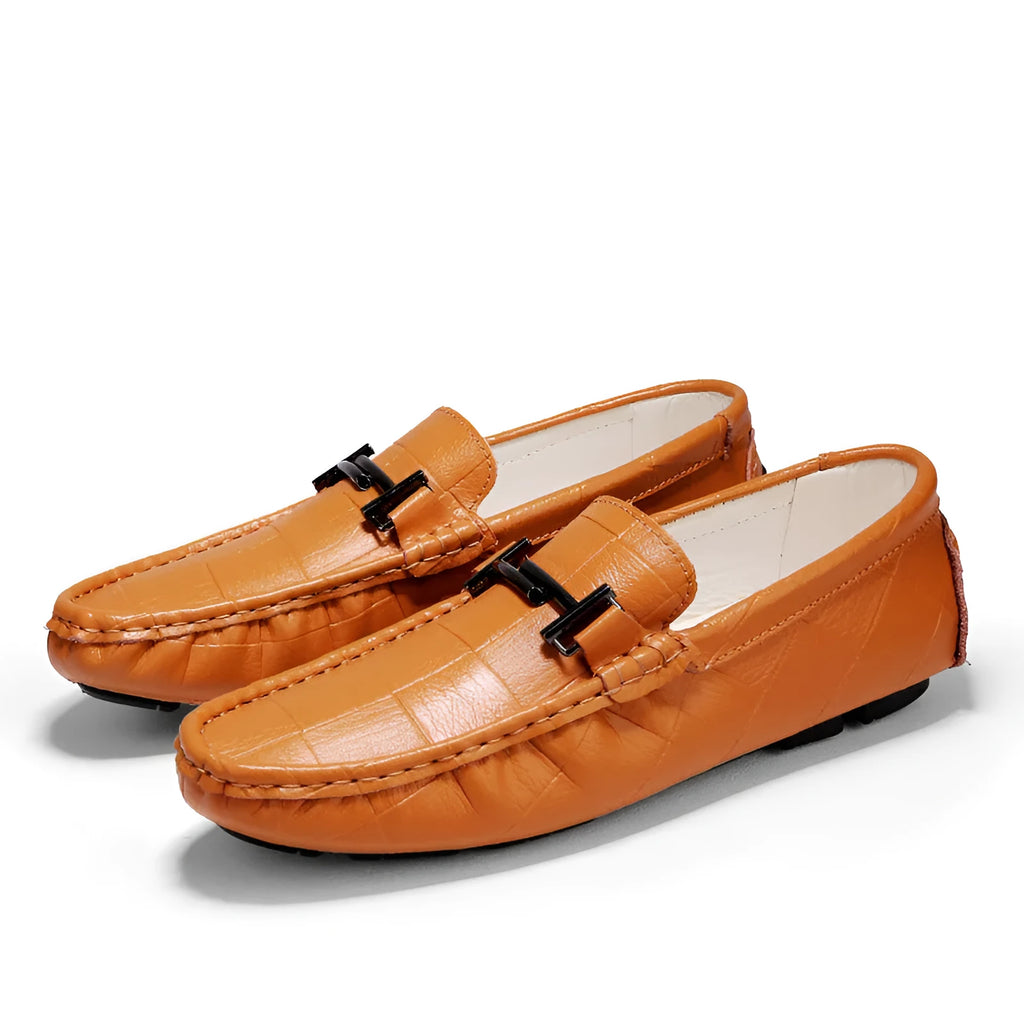 Men's black casual leather peas shoes with a belt buckle detail and flat rubber sole on a white background