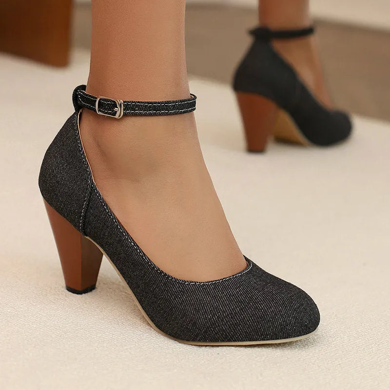 Blue denim women's high heel ankle boots with a silver buckle and waterproof platform sole.