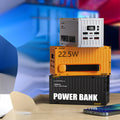 Yellow 50,000mAh power bank with digital display showing battery percentage and five output ports