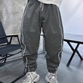 Men's loose fit cropped sports trousers in bamboo fibre, shown in khaki colour.