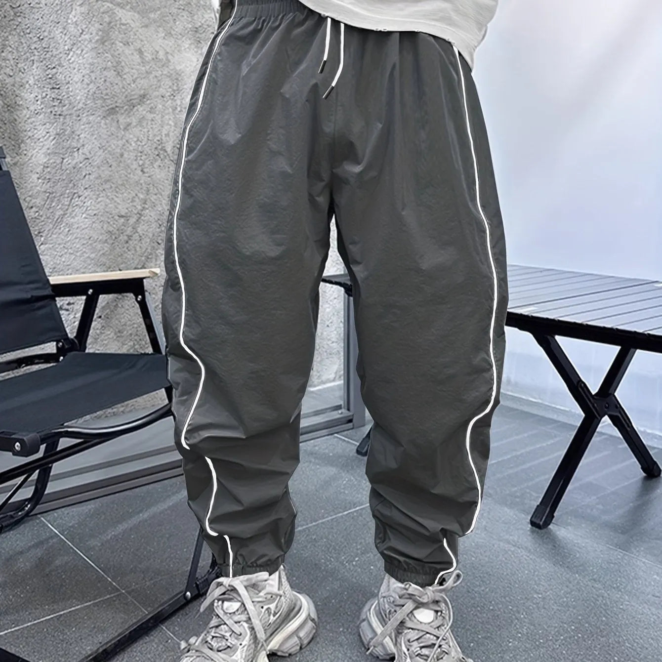 Men's loose fit cropped sports trousers in bamboo fibre, shown in khaki colour.