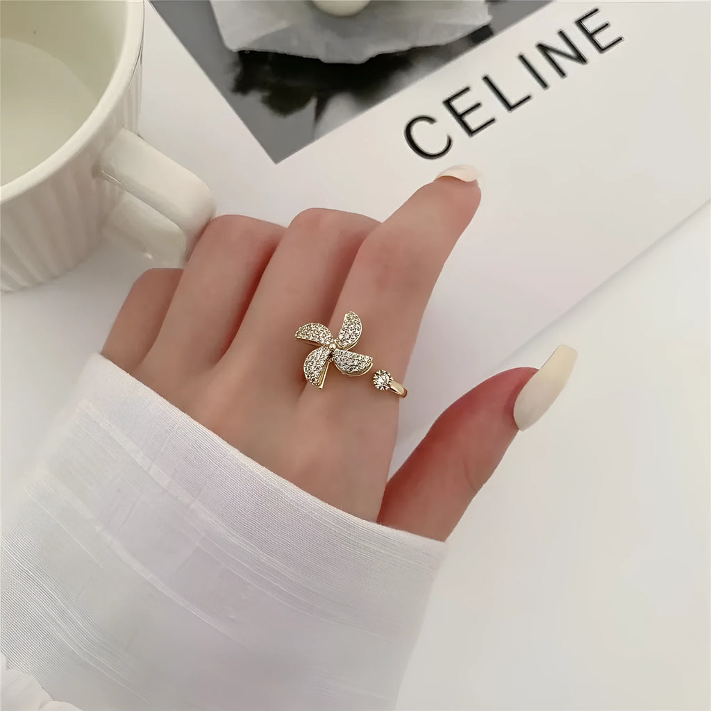 Copper rotating windmill ring with micro inlaid geometric design in gold and silver electroplated finish
