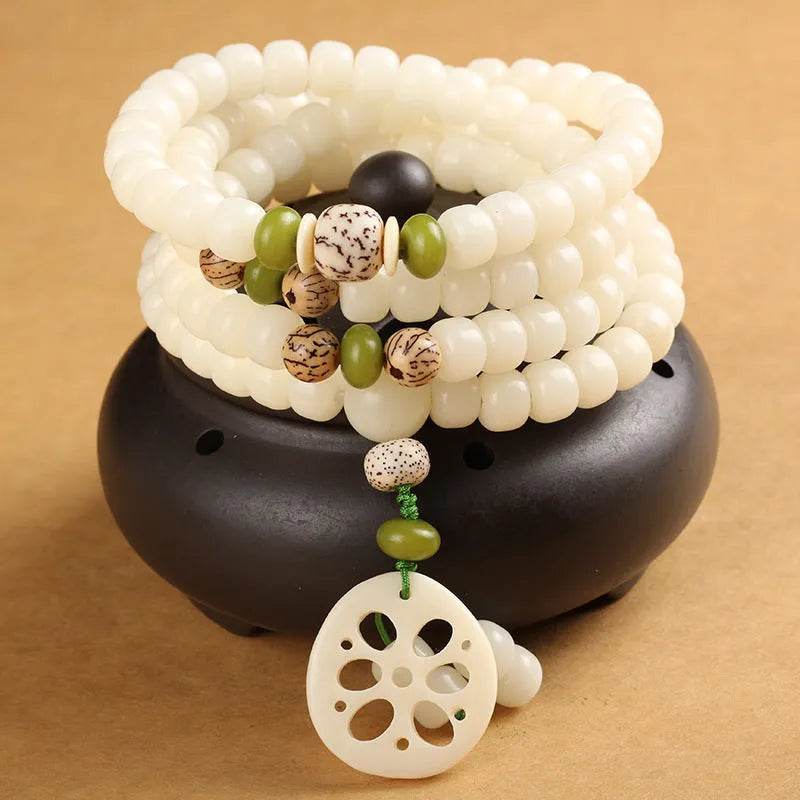 White jade Bodhi bead bracelet with 6x8mm beads in various decorative styles