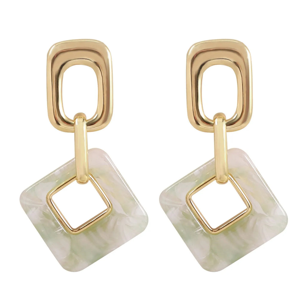Pair of hollow square earrings with bevelled corners in a metallic finish, shown on a white background.