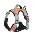 Orange polyester dog harness chest strap with hand holding rope, shown on a medium-sized dog.