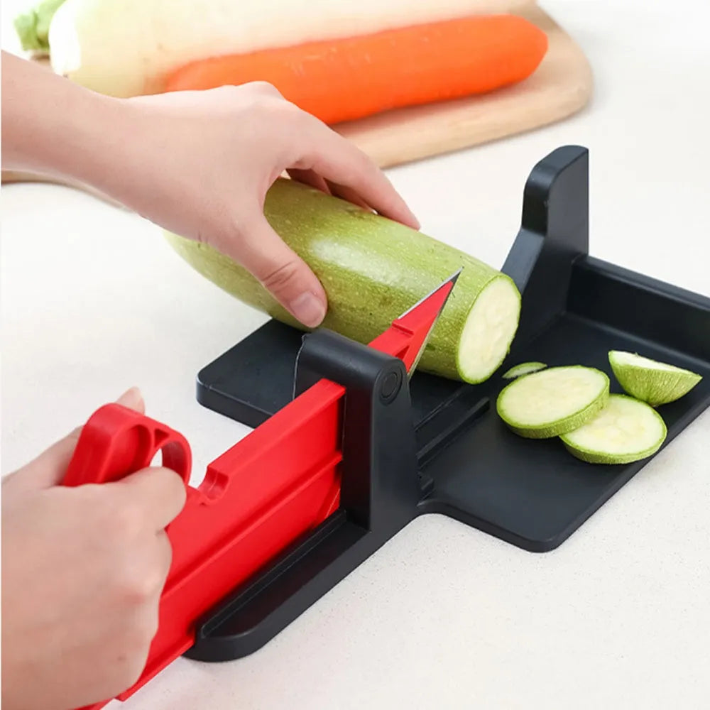 Green and red vegetable cutter with stainless steel blade for slicing carrots and potatoes