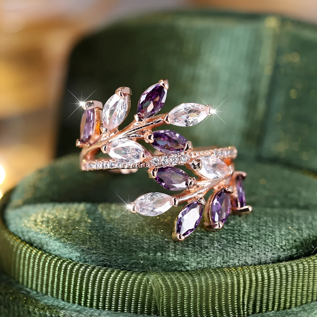 Adjustable copper leaf ring with zircon detailing in multiple colour options on display