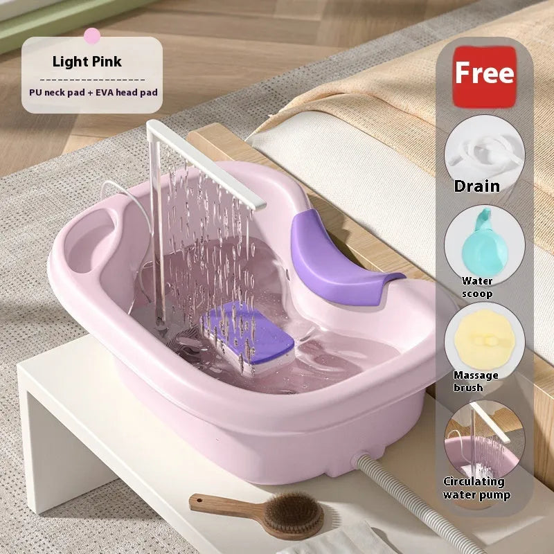 Light pink lying down hair wash basin with head pad, neck pillow, water pump and hair washing accessories