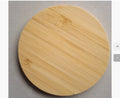 Square brown bamboo wood 5W wireless charger with green LED indicator on desk