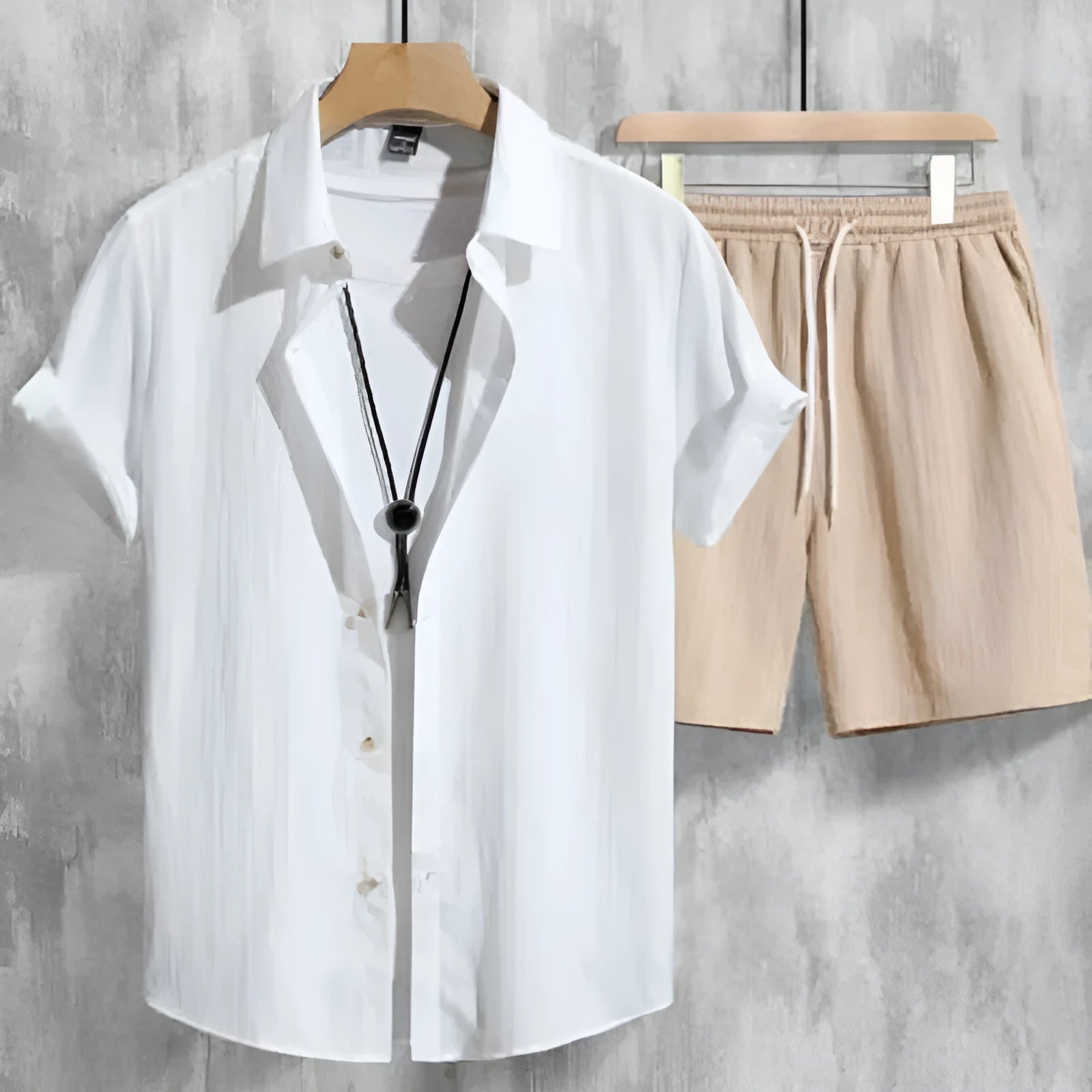 Men's casual Hawaiian print short sleeve shirt and matching shorts outfit on a hanger.