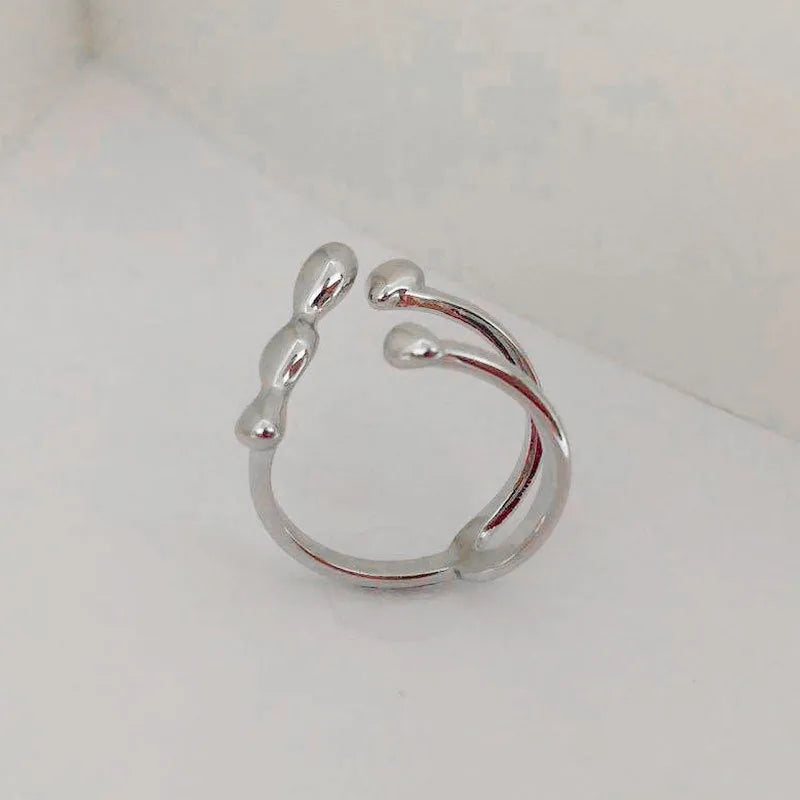 Brass opening ring with sphere circle detail in gold colour, adjustable women's fashion jewellery