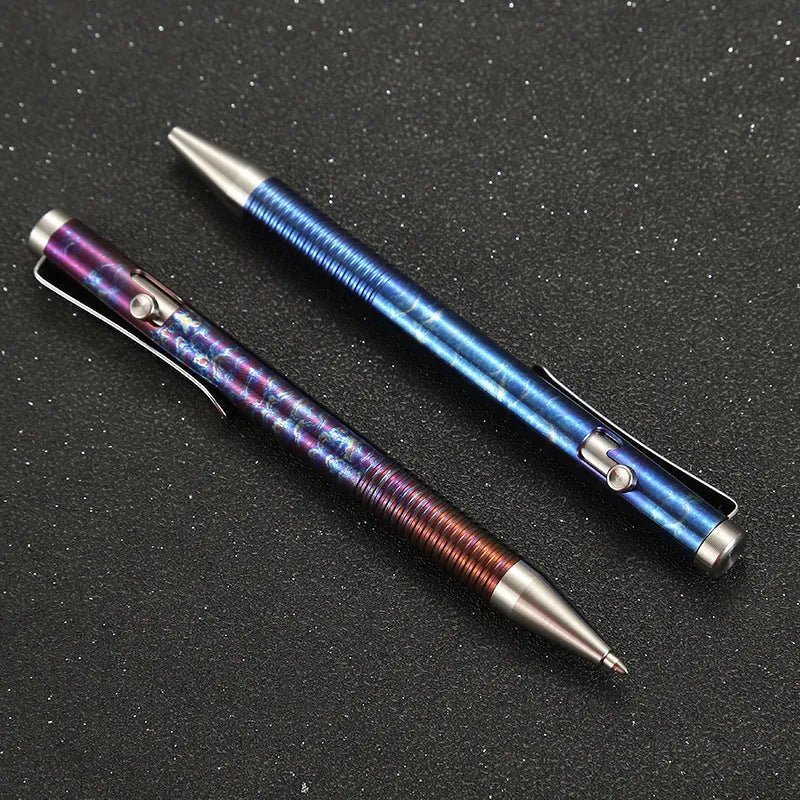 Titanium alloy magic colour pen with gun bolt handle design on a dark background.