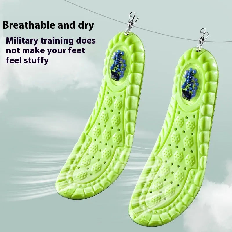 Green PU air cushion sports insoles with argy wormwood for sweat absorption, shown on a white background.
