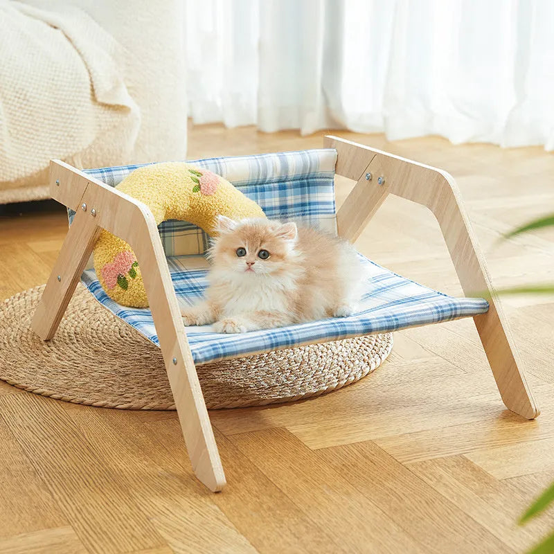 Elevated wood frame cat hammock bed with soft cloth covering in beach chair style design