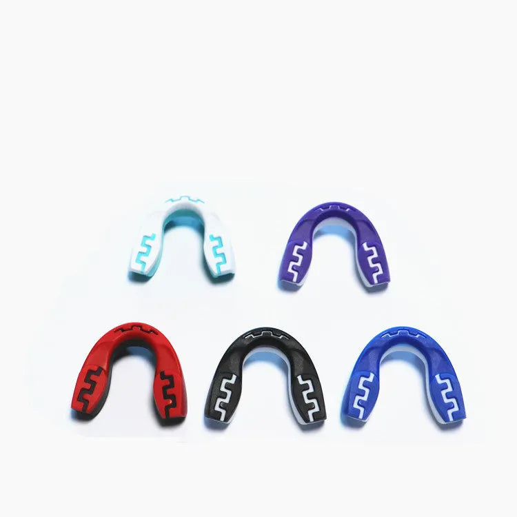 Adult boxing sports mouthguard with printed teeth design in black and white colour.