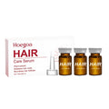 Three bottles of hair root liquid treatment with ginger and rosemary oils