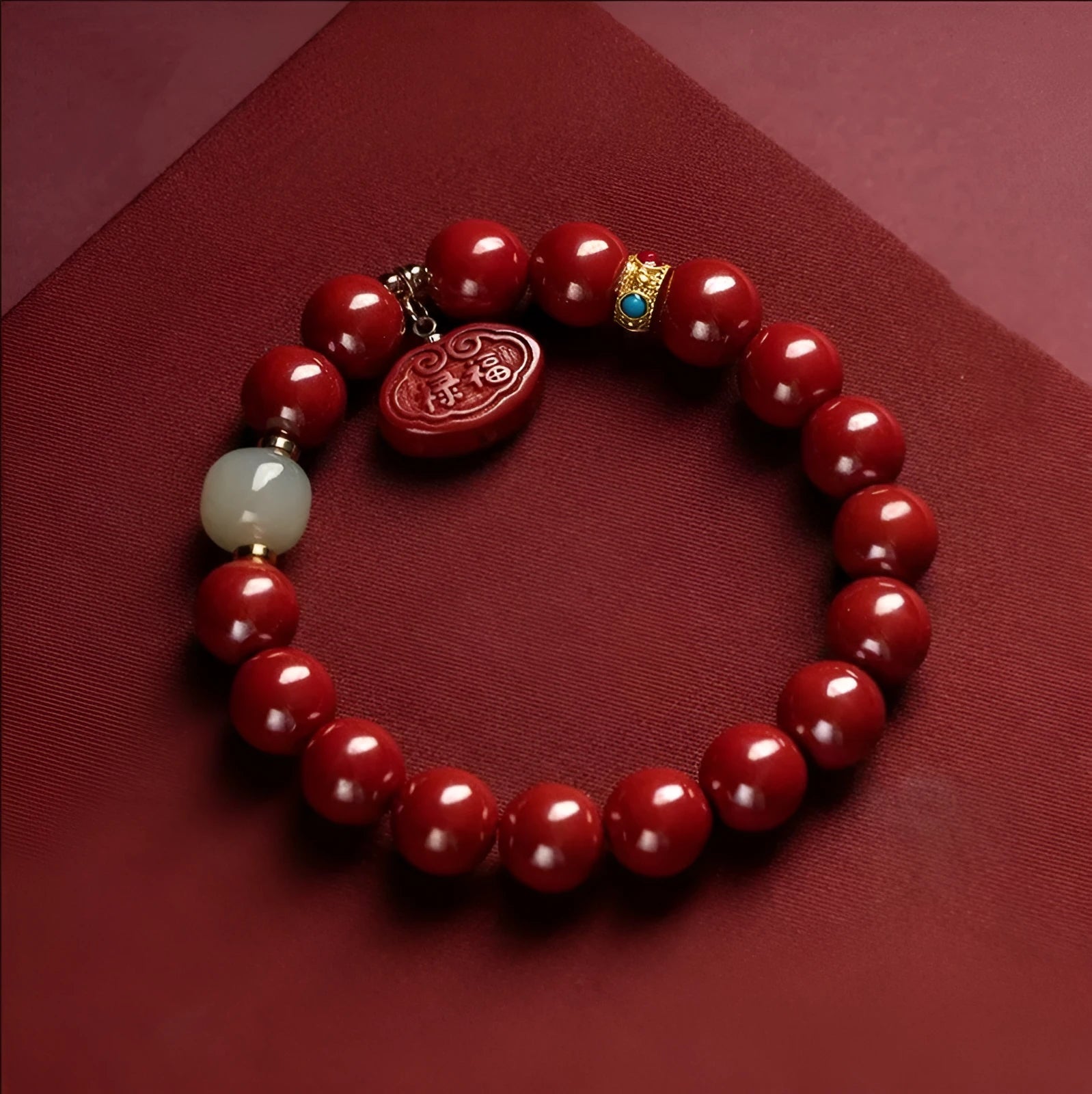 Natural red cinnabar bracelet with Ping An Fu Lu symbol carved in emperor sandstone style.