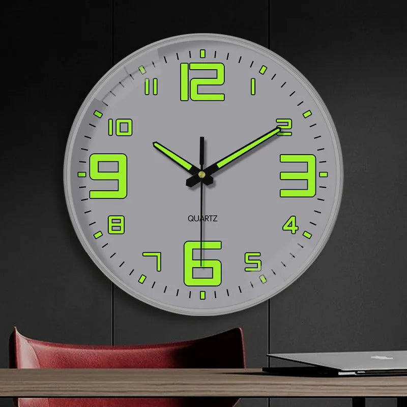 Modern 8-inch luminous wall clock with white plastic case on a wall.