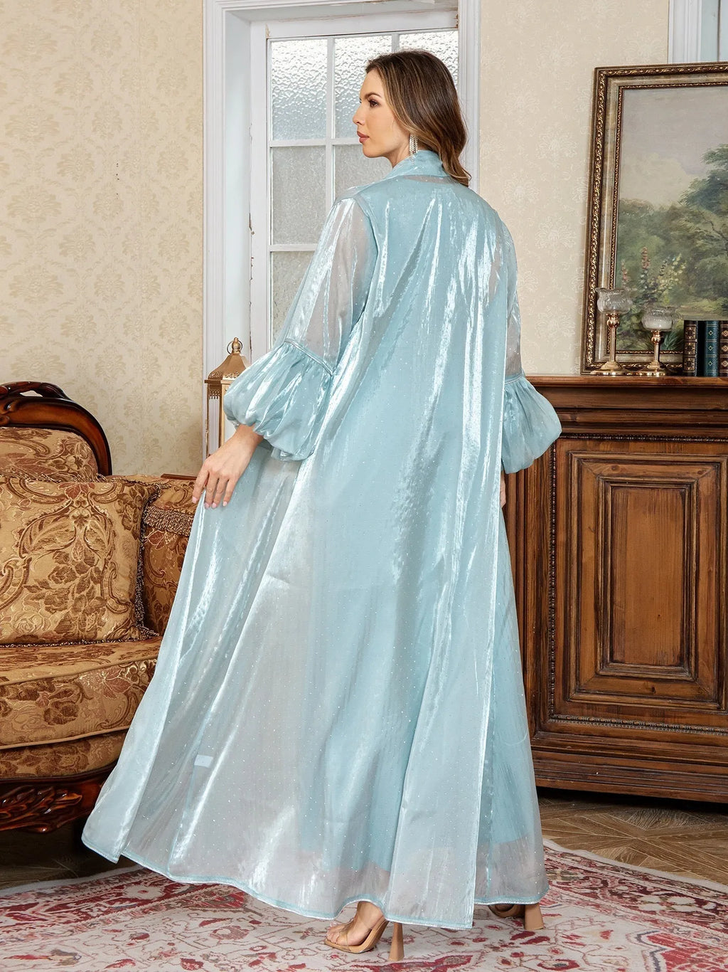 Arabic style two-piece dress set with long sleeves and rhinestone straps in blue.