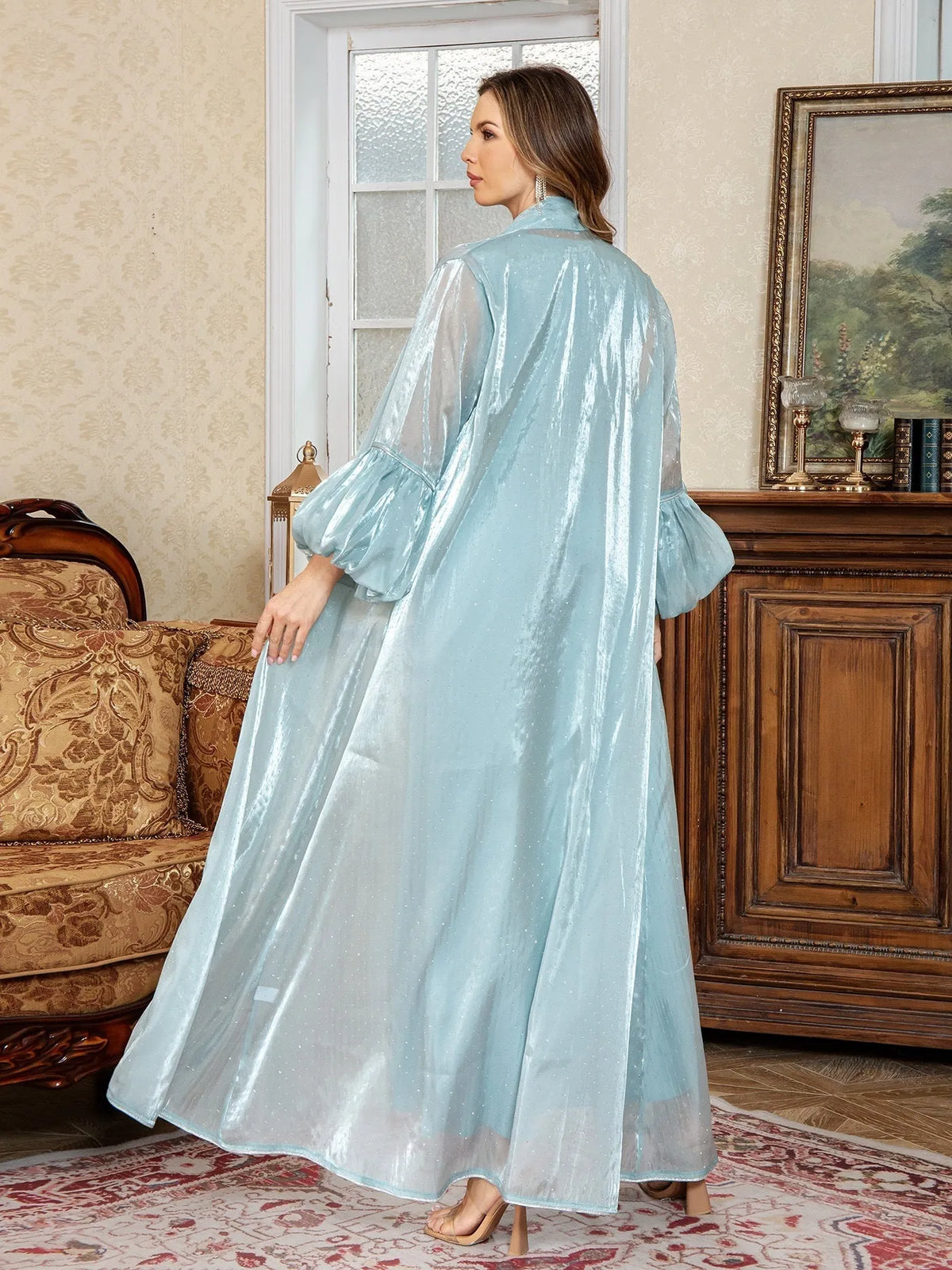 Arabic style two-piece dress set with long sleeves and rhinestone straps in blue.