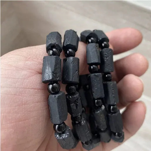Natural black tourmaline rough stone bracelet with approximately 9mm beads and seiko polished finish